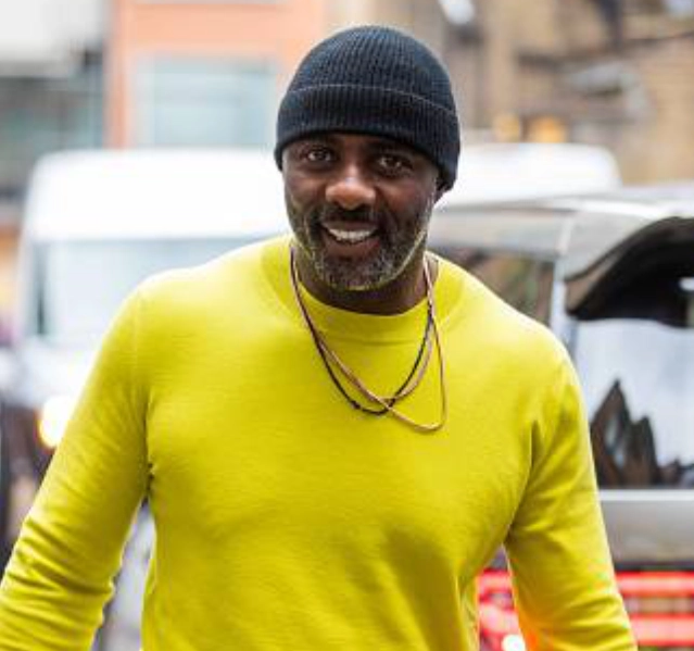 ideris elba in a skull cap beanie